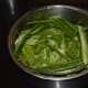 Collect the ridge gourd peels in a container.