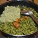 Step ten: Add masala paste. Throw in jaggery powder. Mix well. Add half a cup of water.