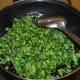 Step seven: Add chopped, squeezed bitter gourd. Saute on medium-low fire.