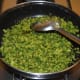 Step nine: Continue stir-cooking until the bitter gourd gets cooked and becomes brownish on the edges.
