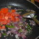 Step four: Throw in chopped tomatoes. Further, saute for two minutes. Add turmeric powder.