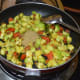 Step six: Throw in coriander powder. Mix well.