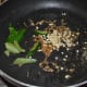 Step one: Heat oil in a deep-bottomed pan. Throw in mustard seeds. Let them crackle. Add cumin, curry leaves, and white lentils. Saute till lentils turn golden.