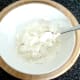 Herbs and spices are stirred in to cream cheese