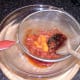 Straining tomato sauce