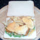 Cheese and onion crisps are laid on fish fingers