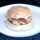 Closed over cheese and onion crisps roll with rocket and tomato sauce