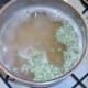 Frozen green peas are added to simmering yellow split peas