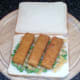 Fish fingers are laid on pea bed