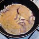 Egg is poured over softened onion