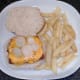 Fries are plated and pickled onion slices top cheese