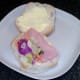 Starting to build ham and salad on roll