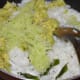 Step four: Add grated butter fruit, grated coconut, cucumber, lemon juice, sugar, and salt. Mix well.
