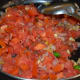 Step seven: Throw in chopped tomatoes. Cook on high heat till they become shape less. Turn off the stove.