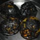 Roast them till they become black on all sides. When they cool down, remove the skin. Roughly chop them.