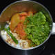 Step three: Put roasted tomato flesh, roasted peanuts, grated coconut, green chilies, tamarind pulp, sugar, and salt into the mixer/blender. Grind, adding water little by little to get a near-smooth sauce.