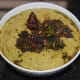 Step four: Transfer the chutney to a serving dish. Temper it as per instructions. Your favorite green tomato chutney is ready! Serve it as a side dish with idli, dosa, rice, or roti. Enjoy the combo.