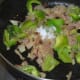 Step seven: Add chopped capsicum and some salt. Saute for two minutes.