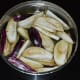 Step two: Immerse sliced eggplant in water for some time.