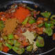 Step nine: Add all spice powders as per instructions. Mix well. Saute for a few seconds.