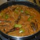 Step eleven: Add two cups of water. Bring the mix to a boil and simmer for 3 to 4 minutes. Turn off the stove.