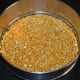 Preparing to cook the de-husked split chickpeas.