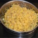 Step two: Strain them. Collect the split chickpeas.