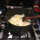 Chop up the chicken into 1-1 1/2 inch cubes. Fill a medium saucepan with 3 cups of water, then add the chicken, cloves, pepper, and turmeric. Heat over high heat until it boils, then reduce heat to simmer and cook for 50 minutes to an hour.