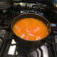 Place the oil into a large casserole dish/dutch oven. Heat over high flame, then place in the chopped 2 onions, and fry until it begins to turn a reddish brown. Then remove from the heat with a spotted spoon, and place them over absorbent paper towel