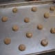 Slightly flattened biscuits are ready to bake.