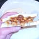 Tucking in to Indian spiced beans and chip butty
