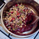 Beans are added to spicy tomato sauce