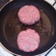 Starting to fry burger patties