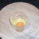 Egg broken in to small glass