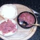 Brawn is spread on buttered bread roll