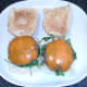 Cheeseburgers are laid on salad beds on rolls