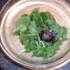 Redcurrant jelly and seasonings are added to salad leaves