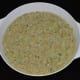 Add a cup of water. Mix well. The batter should be thick.