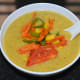 Your favorite fresh corn soup is ready! Pour it equally into 4 bowls. Top each of them with 2 tablespoons of the sauteed veggies. Enjoy sipping this creamy, crunchy, and delicious soup!