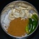 Step three: Grind grated coconut, green chilies, ginger, garlic, cashew nuts, coriander leaves, and kitchen king masala together adding water little by little to get a smooth paste.