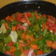 Step five: Stir-cook them, sprinkling some water till they become tender yet crunchy. Throw in tomatoes. Cook till they wilt. By this time, the contents turn almost dry.
