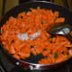 Step two: Increase the heat. Add some salt. Mix well. Stir-cook for 3 minutes.