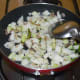 Step three: Add diced knol-khol. Add some salt. Stir-cook on a high heat for 5 to 6 minutes.