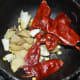 Step four: Saute ginger, cumin seeds, red chilies, and garlic for a minute in olive oil or butter.