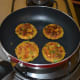 Step four: Roast both the sides, adding oil little by little to get crunchy fritters.
