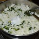 Step six: Add remaining salt. Add grated coconut. Mix well.