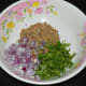 Step two: Add finely chopped onions and chopped fresh green coriander. Mix well.