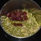 Step one: Put moong sprouts, ginger, garlic, dry red chilies, and salt in a mixer or blender. Grind to get a coarse paste.