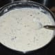 Step five: Add fruit salt or cooking soda. Give a quick stir. The batter increases in volume and becomes light.