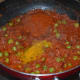Step six: Throw in turmeric powder, sambar/curry powder, remaining salt, and sugar. Saute further, for a minute.